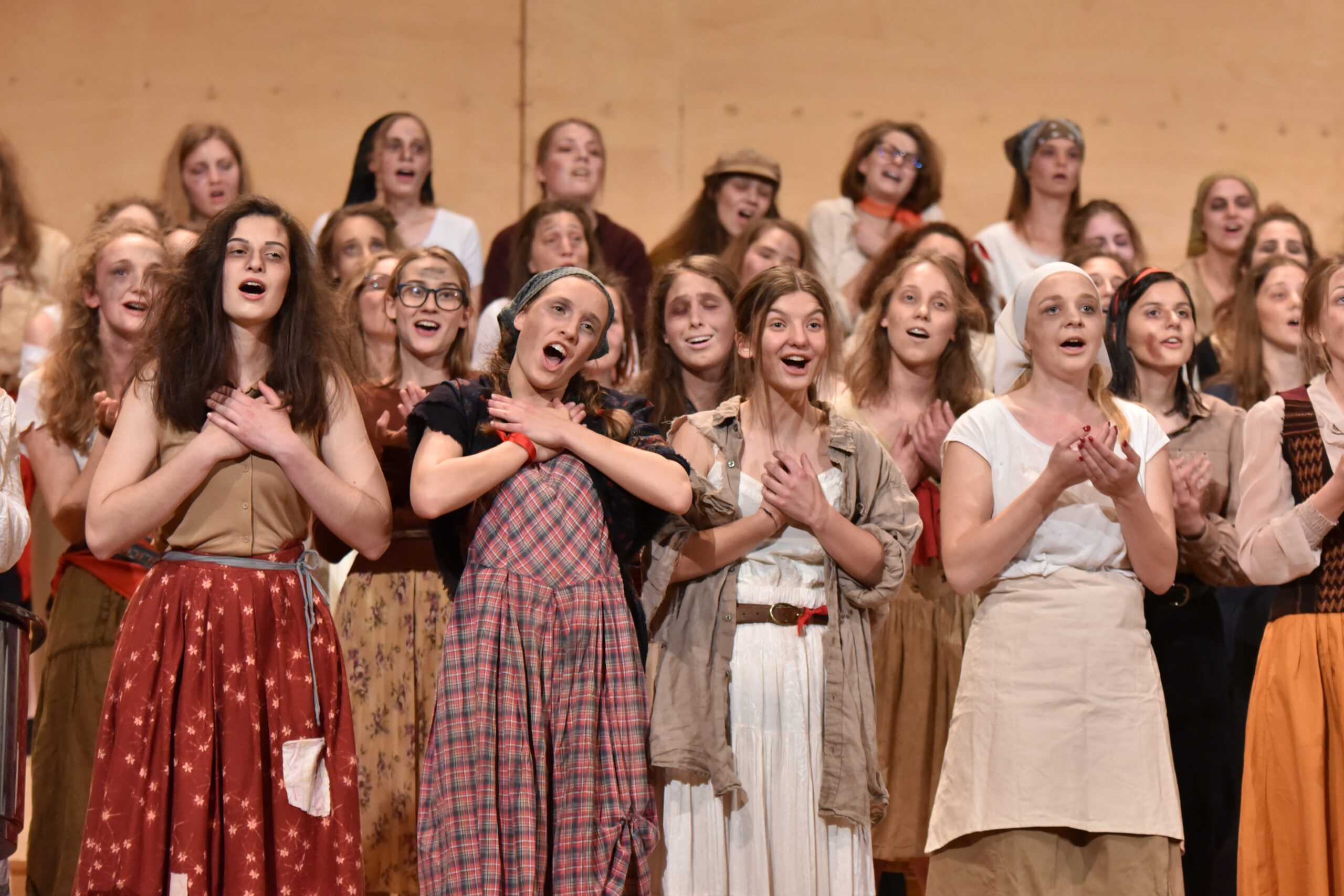 Janez Eržen, Slovenia: Les Misérables, 2019, (Re)Mixed Choir of the Diocesan Classical Gymnasium, Slovenia  - A scene from the musical Les Misérables. A fine example of costume design that upgrades the message of the performance.